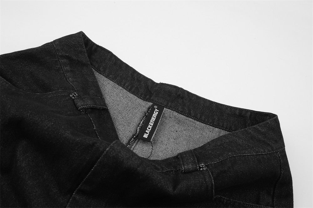 Black denim waistband turned open to show inner label and lining