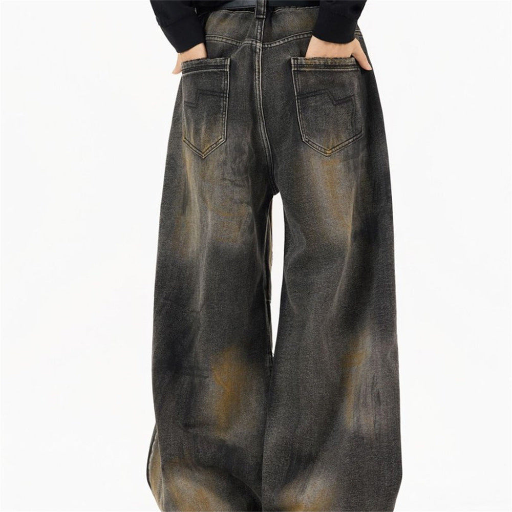 Men's distressed baggy wide-leg jeans in charcoal rust washed denim with pleated knee panels and straight-cut silhouette