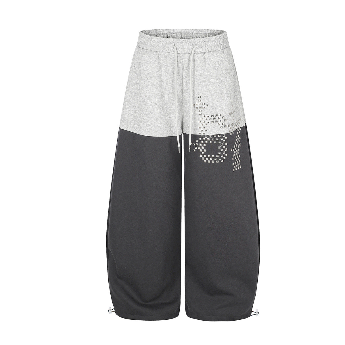 Colorblock-Sweatpants mit weitem Bein in Hellgrau und dunklem Anthrazit, Pixel-Nietenmotiv und gerafftem Beinabschluss