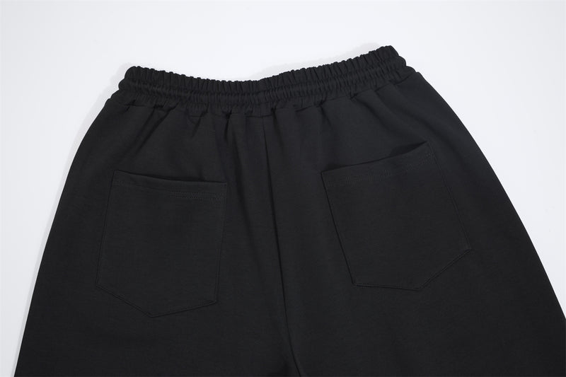 Pantalon de survêtement à jambes larges avec imprimé numéro universitaire et étoile