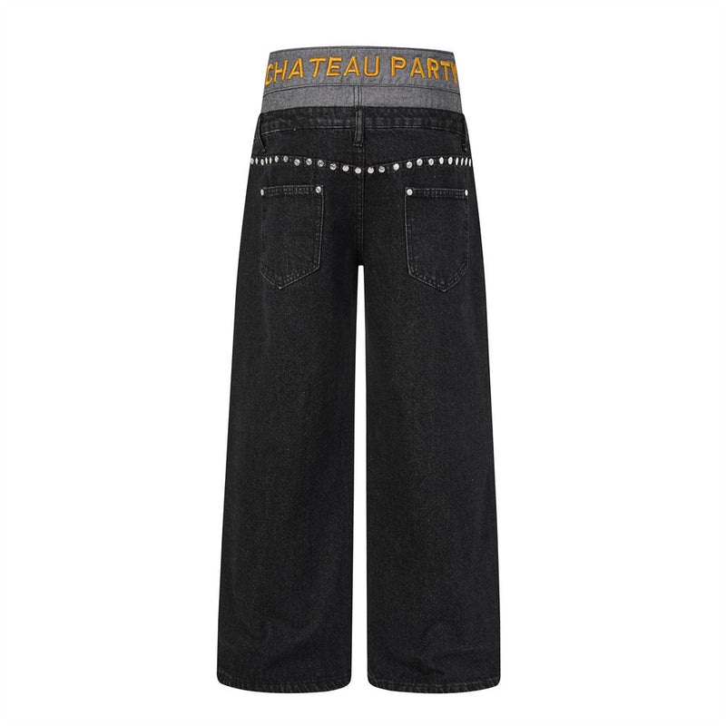 Back view of black wide-leg jeans with gray double waistband and silver stud trim