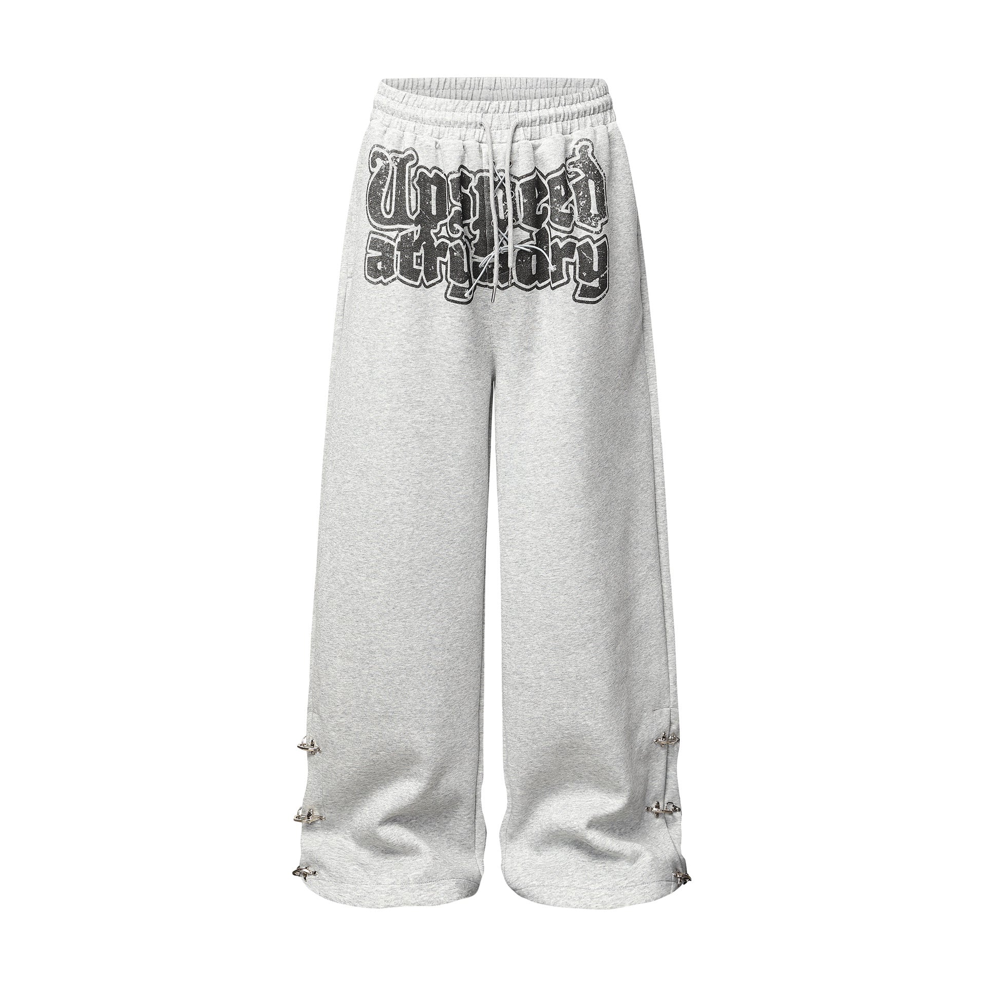 Pantalon de survêtement à jambes larges gris chiné avec imprimé graffiti effet usé et détails métalliques argentés en forme de pointes aux ouvertures des ourlets