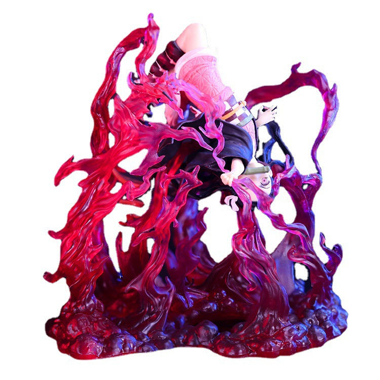 The Demon Slayer Figure - Nezuko Explosion Pose by Demon Slayer features a character in a pink outfit with a hair ribbon, posed upside down amid swirling red and purple translucent flames, creating a dynamic effect that captures the essence of the anime&