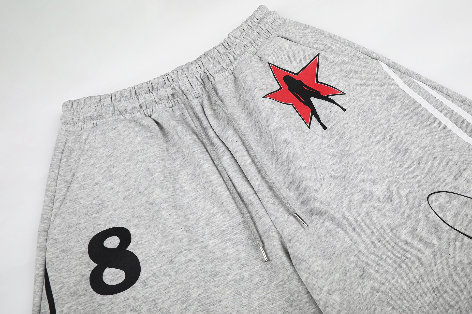 Pantalon de survêtement à jambes larges avec rayures rétro et imprimé graphique