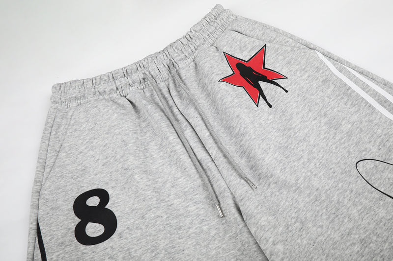 Pantalon de survêtement à jambes larges avec rayures rétro et imprimé graphique