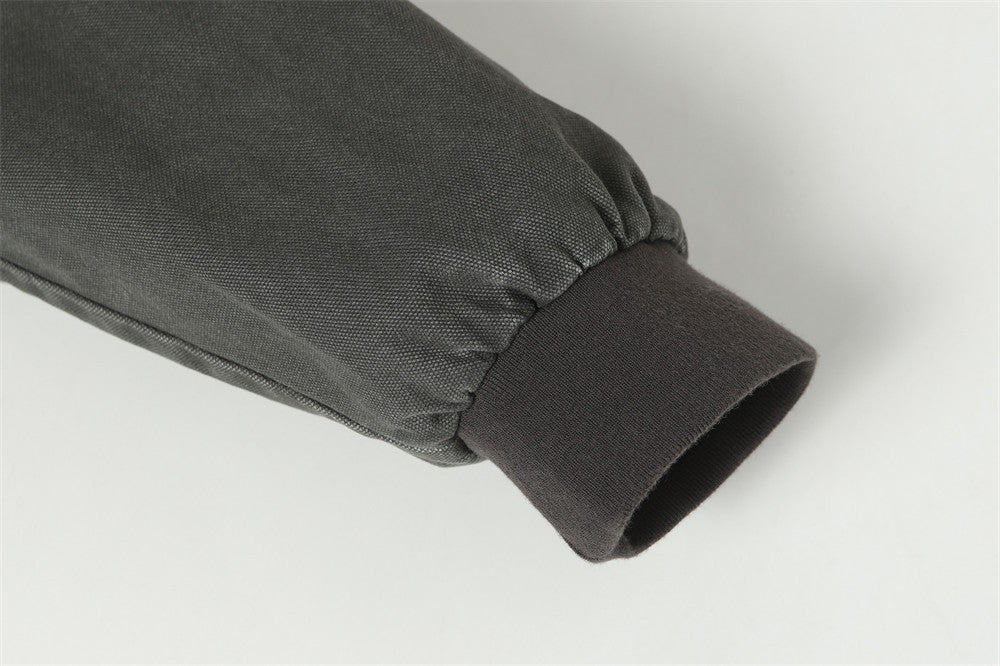 Blouson bomber déconstruit en toile à coutures effilochées et zip diagonal