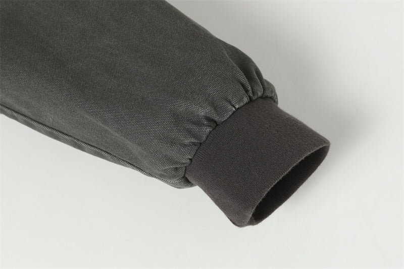 Blouson bomber déconstruit en toile à coutures effilochées et zip diagonal