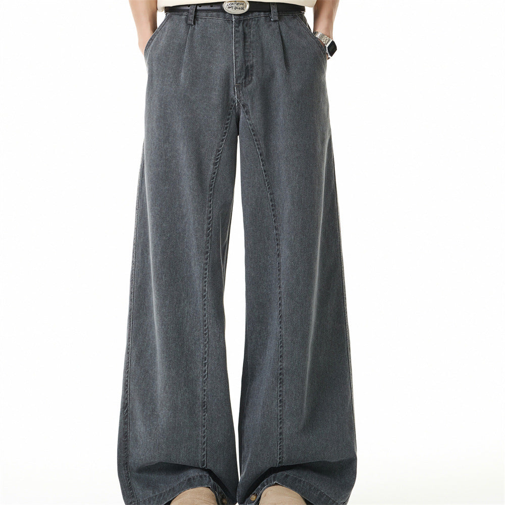Cement grey wide-leg washed denim jeans with pleated waistband and metal button hem detail, front and back view