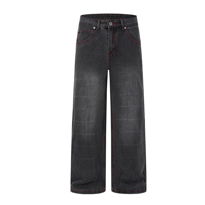 Wide-leg washed black denim jeans with gothic wing and star print on back panel and red contrast stitching