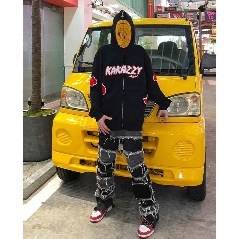 A person stands before a yellow vehicle sporting Seakoff&