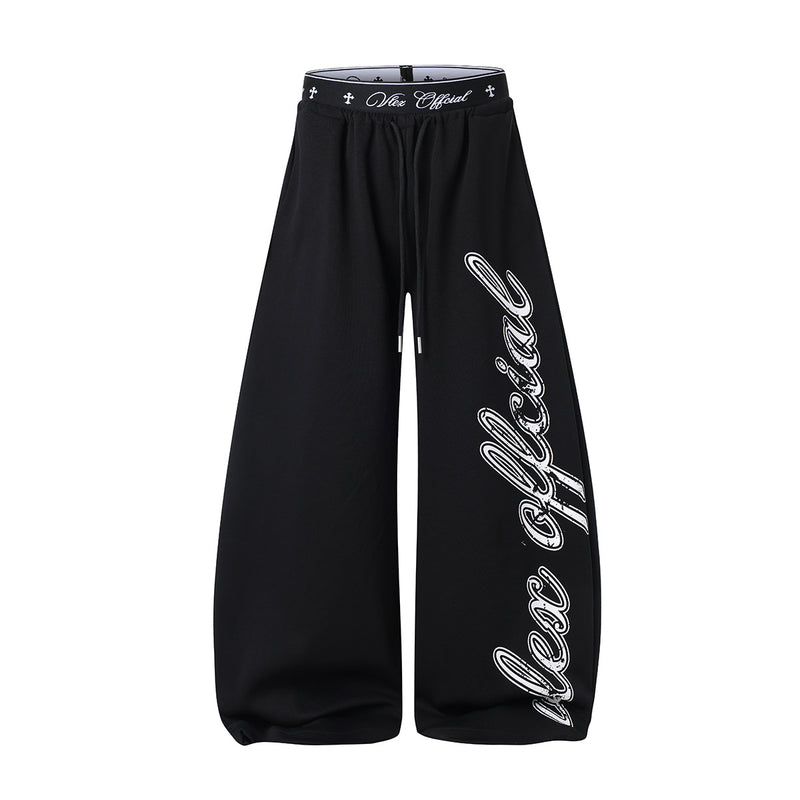 Pantalon de survêtement à jambes larges avec logo cursif et ceinture élastiquée