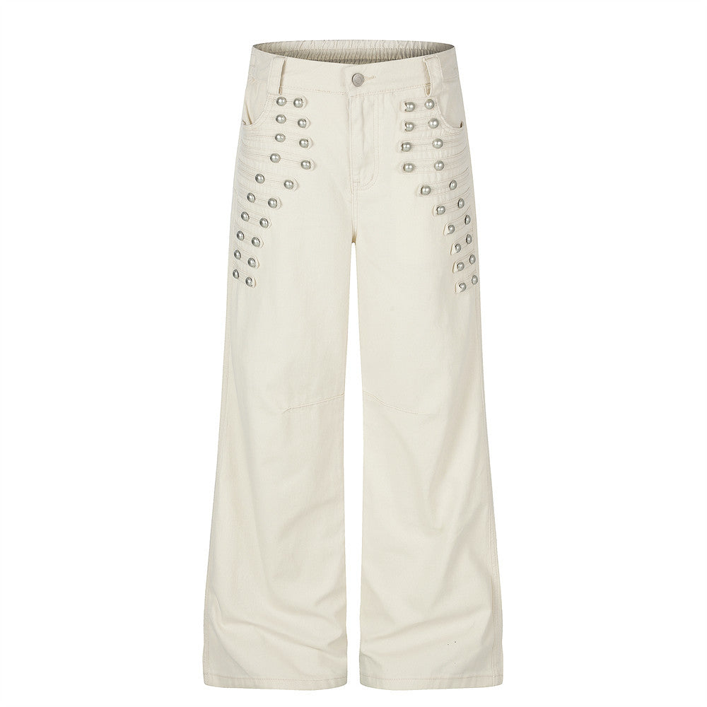 Pantalon homme coupe large orné de perles et de clous métalliques