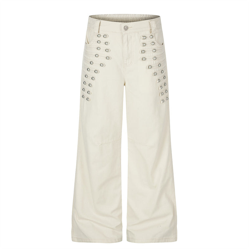 Pantalon homme coupe large orné de perles et de clous métalliques