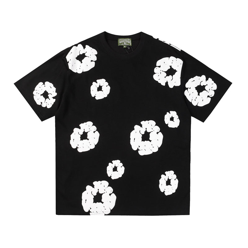 Denim Tears black cotton T-shirt with all-over white wreath print on front and sleeves, crew neck, flat lay view