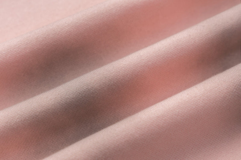 Pantalon de survêtement wide leg – Rose délavé avec bande latérale et écusson brodé