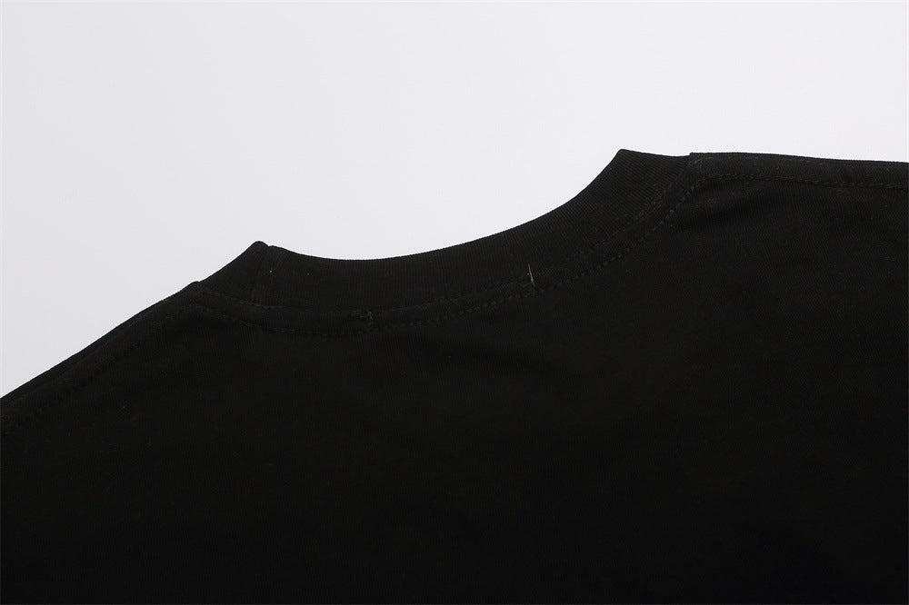 Black T-shirt shoulder and crew neckline close-up