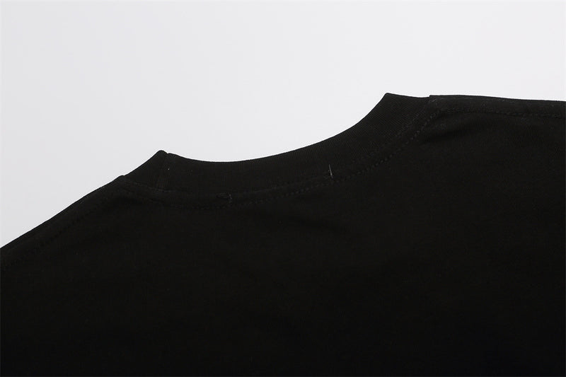 Black T-shirt shoulder and crew neckline close-up