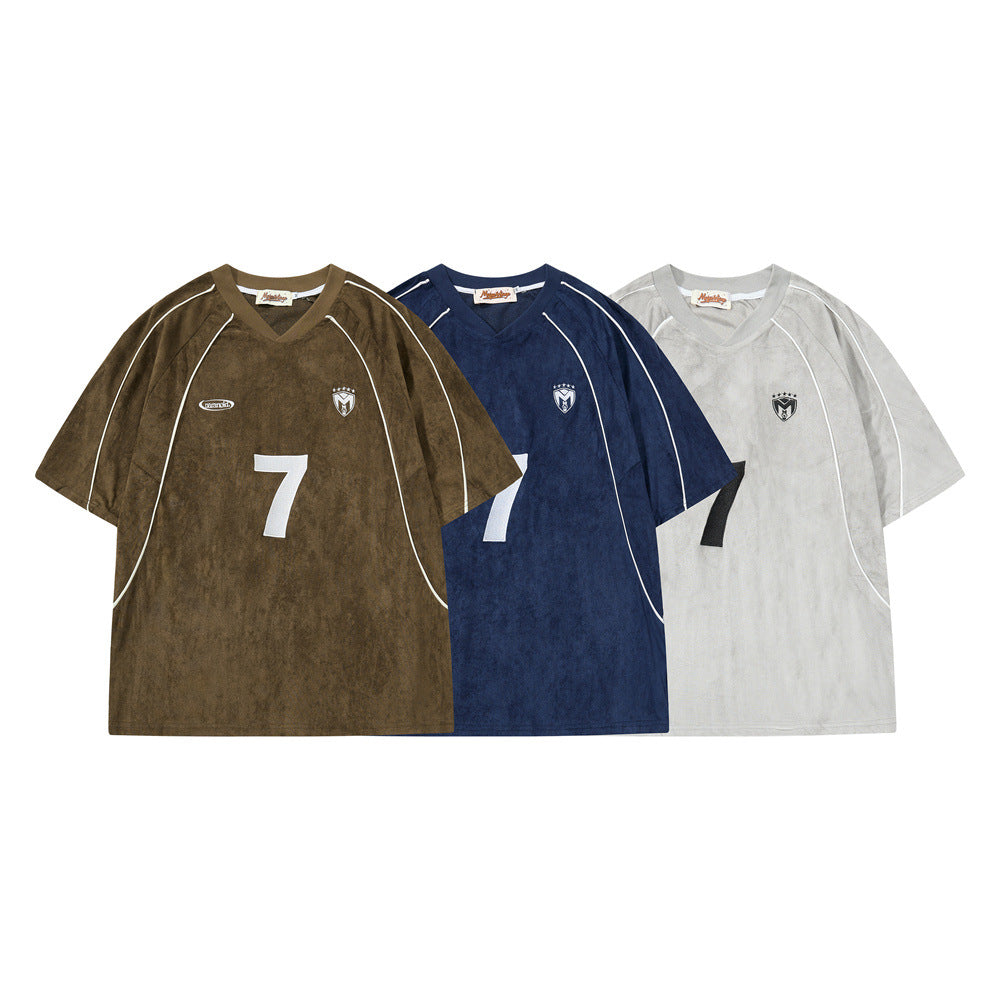 Oversized number 7 embroidered V-neck soccer jersey tee in olive brown with white piping and shield crest badge