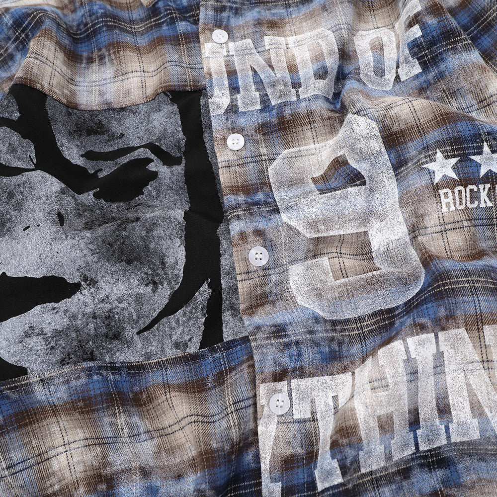 Close-up of front graphic on plaid shirt showing face print, number 9 and lettering