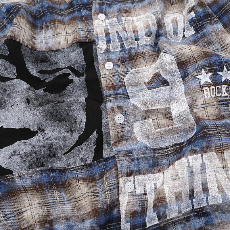 Close-up of front graphic on plaid shirt showing face print, number 9 and lettering