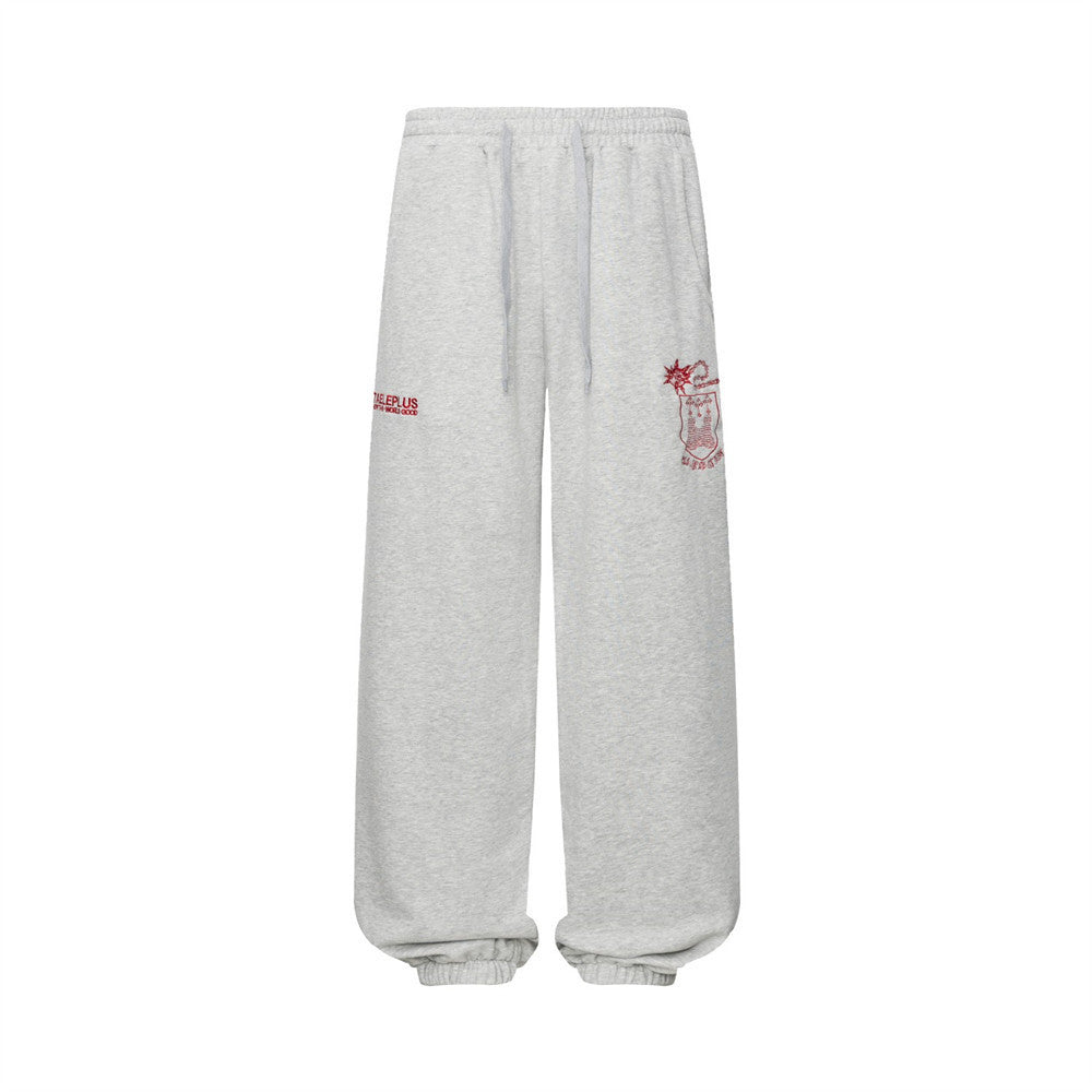 Pantalon de survêtement homme à jambes larges, gris chiné, avec écusson rouge brodé et imprimé graphique à inscription, coupe streetwear décontractée