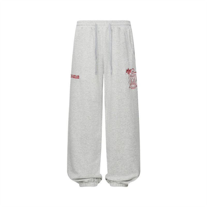 Pantalon de survêtement homme à jambes larges, gris chiné, avec écusson rouge brodé et imprimé graphique à inscription, coupe streetwear décontractée
