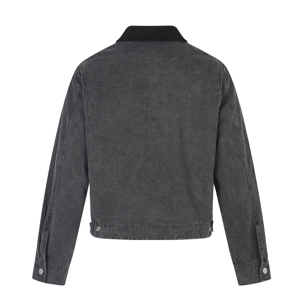 Back view of black distressed jean jacket with plain panel and brown collar