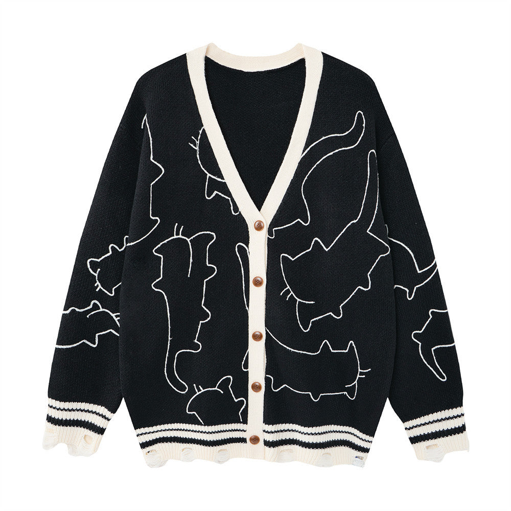 Cardigan oversize en maille à col V avec broderie représentant le contour d’un chat blanc, bordures contrastantes crème et ourlet effet usé, coloris noir