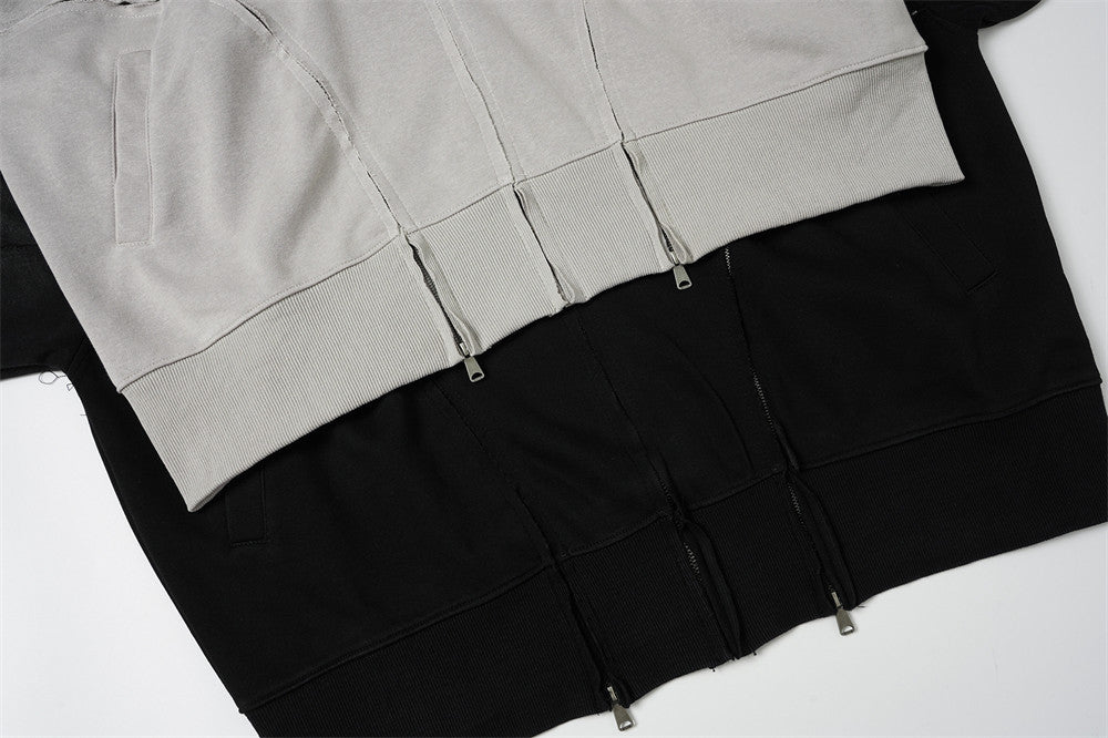 Sweat à capuche oversize zippé – Finition délavée usée, poches à multiples zips et bords bruts