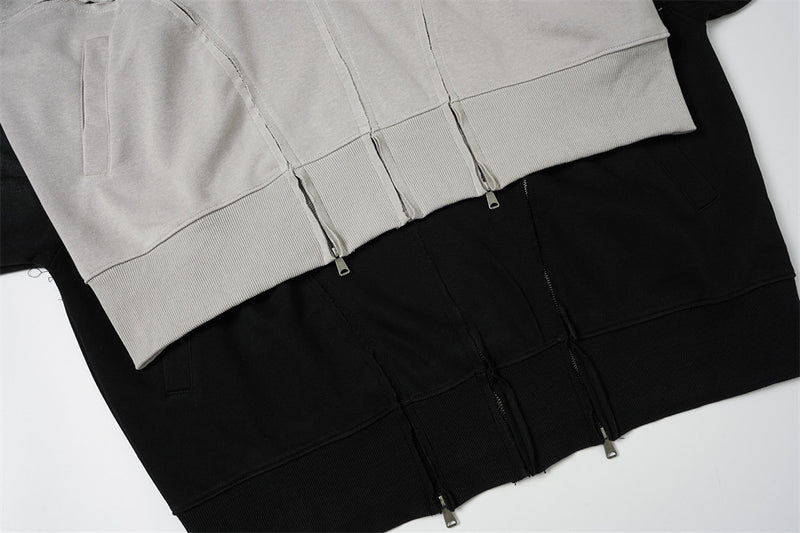Sweat à capuche oversize zippé – Finition délavée usée, poches à multiples zips et bords bruts