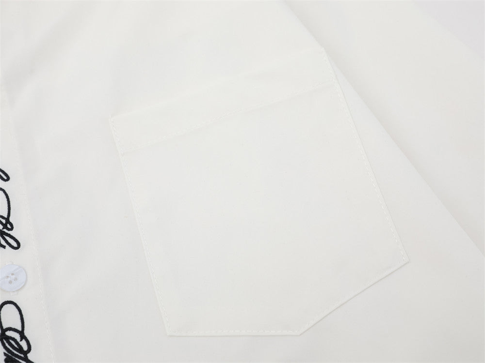 Close-up of white chest pocket on oversized button-down shirt