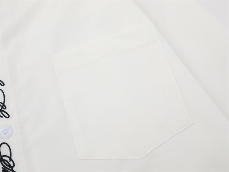 Close-up of white chest pocket on oversized button-down shirt