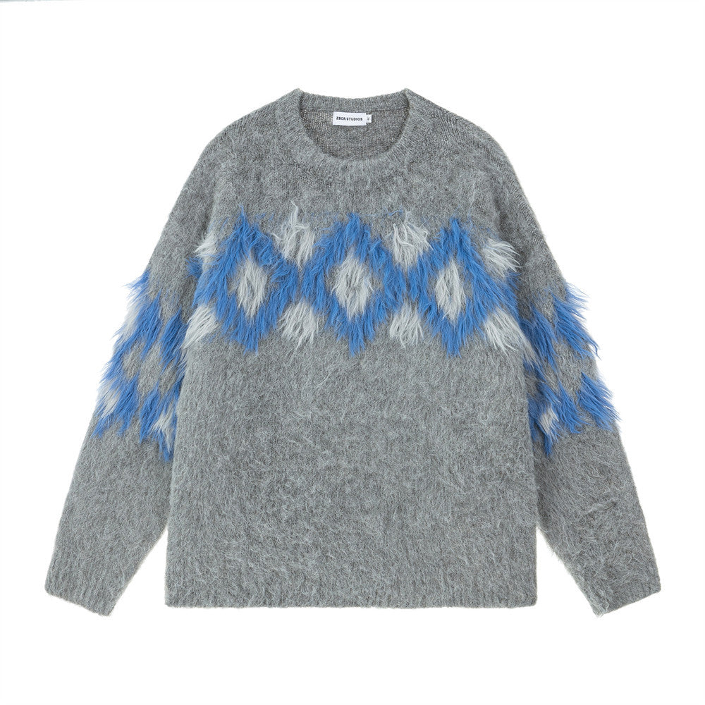 Oversized diamond jacquard fringe crewneck sweater in heather grey with blue and white argyle pattern and tassel trim on ches