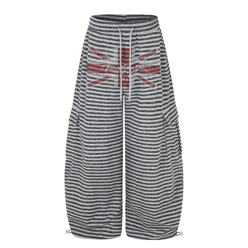 Wide-leg grey striped cargo pants with rhinestone Union Jack emblem on front hip pocket and adjustable drawcord hem