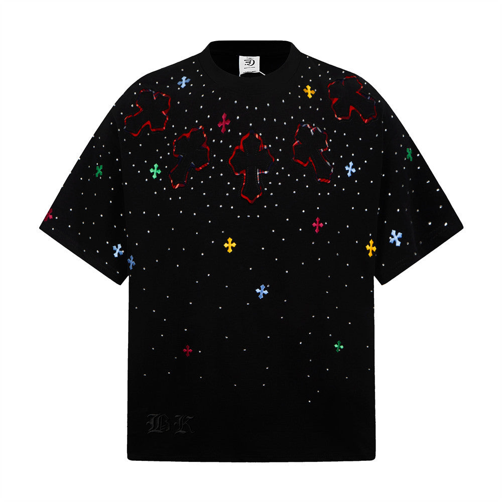 Oversized black t-shirt with large embroidered cross patches, rhinestone studs, and multicolor cross embroideries on the fron
