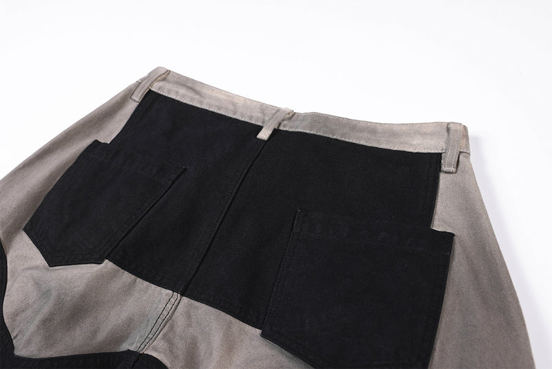 Wide-Leg-Patchworkhose – abstraktes Wellenmuster aus zweifarbigem, schwarz-grauem Washed-Denim