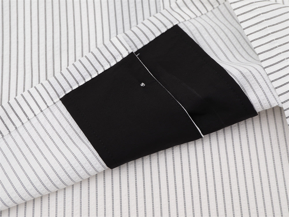 Close-up of black collar underside and striped shirt fabric detail