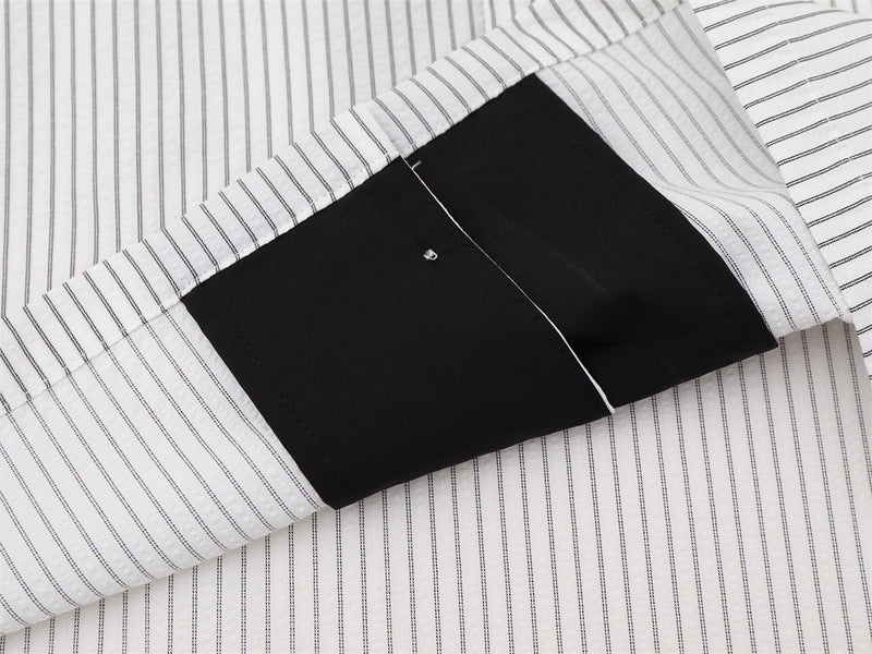 Close-up of black collar underside and striped shirt fabric detail