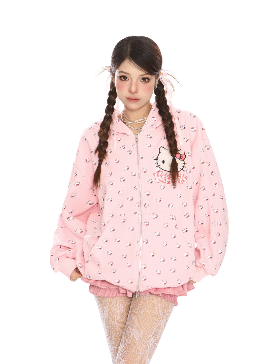 An individual with long braided hair wears a Seakoff Hello Kitty Pink Kawaii hoodie, featuring an oversized zip-up design with cat ear hood and all-over print, highlighting Sanrio&