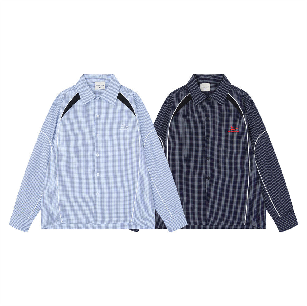 Two plaid long sleeve shirts in light blue and navy with contrast piping, front view