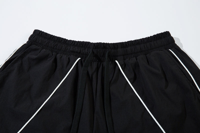 Herren-Trackpants mit kontrastierender Paspel und Colorblock-Seiteneinsätzen