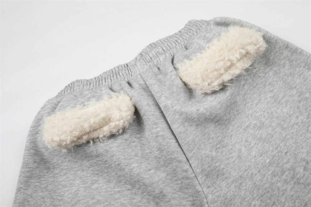 Sweatpants mit weitem Bein, Sternstickerei und umgeschlagenem Sherpa-Bund