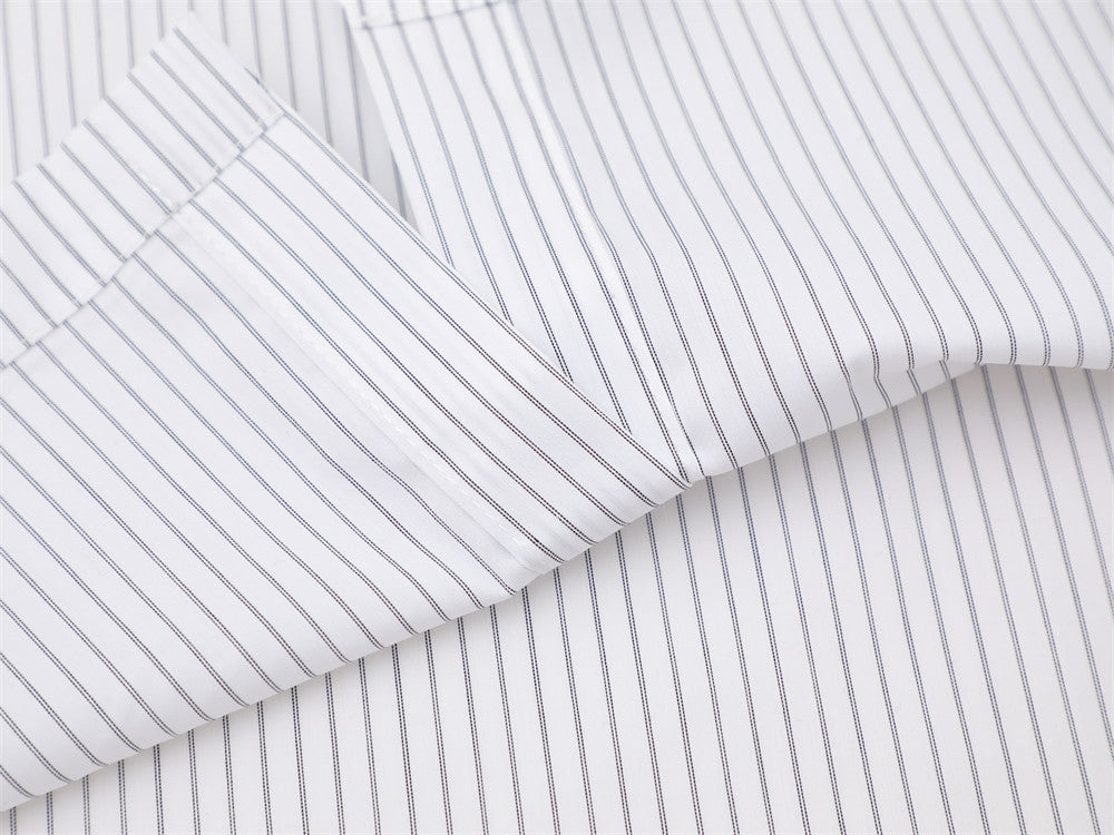 White fabric with fine vertical pinstripes and sleeve seam detail