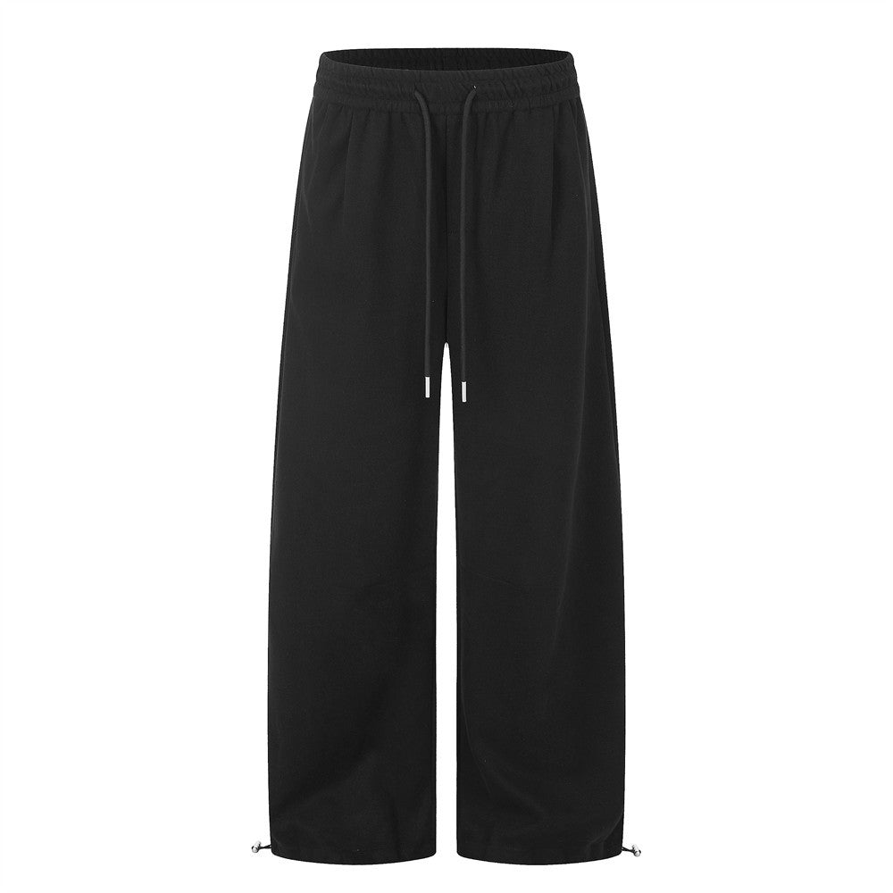 Men's wide-leg sweatpants with elastic drawstring waist and ankle toggles in black and heather gray