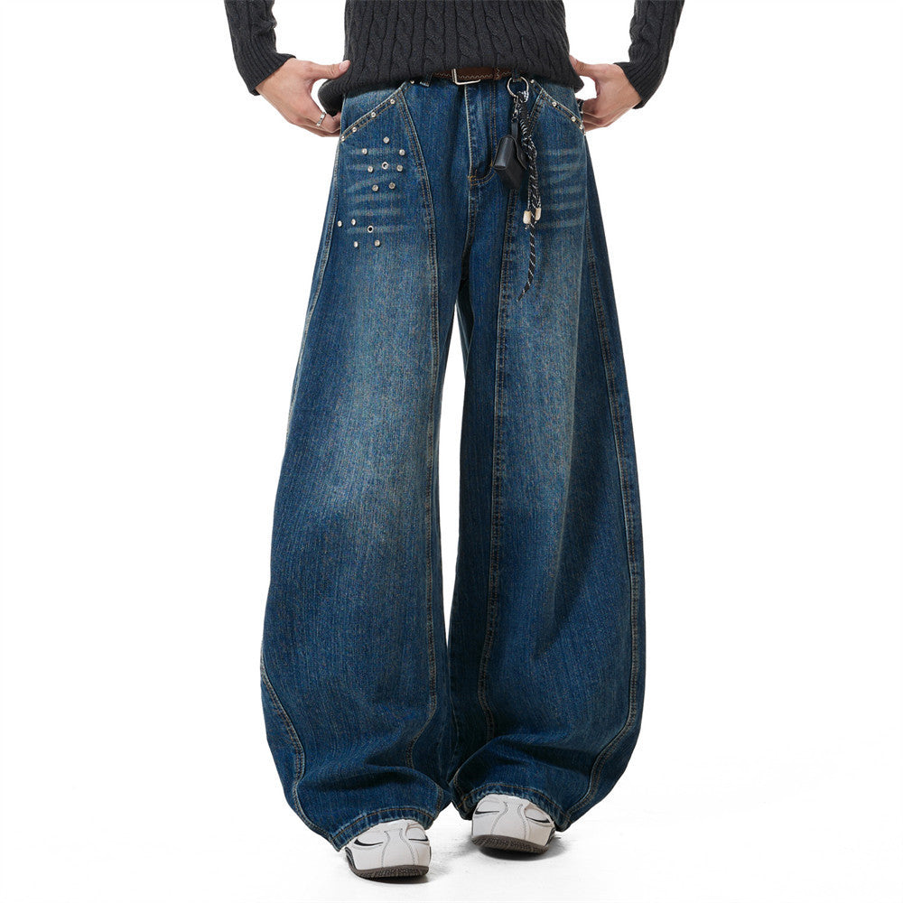 Men's baggy wide-leg rivet punk washed denim jeans in deep blue with oversized barrel-leg silhouette