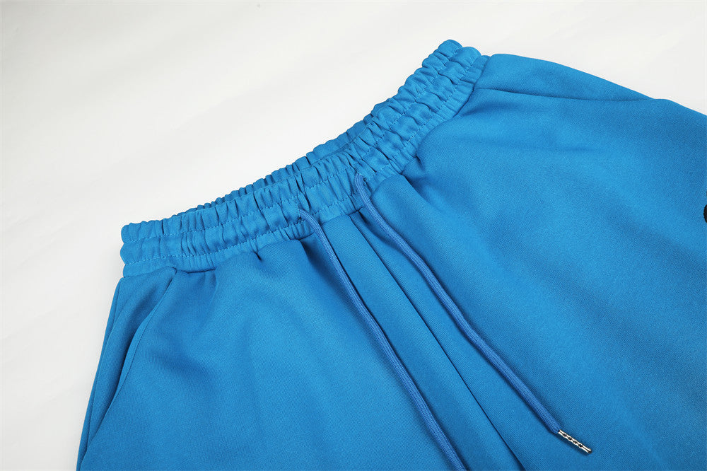 Close-up of blue sweatpants waistband and drawstring with elastic waist detail