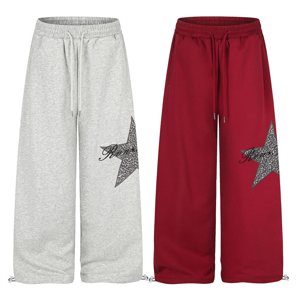 Wide-leg sweatpants in gray and red with leopard star patch and drawstring hems
