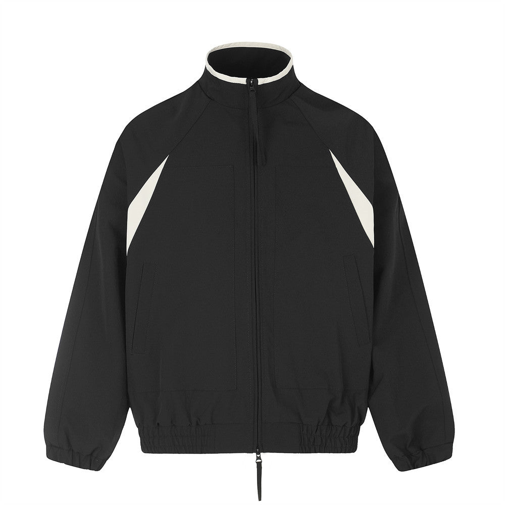 Men's mock neck colorblock zip-up track jacket in black with off-white contrast panels, relaxed oversized fit