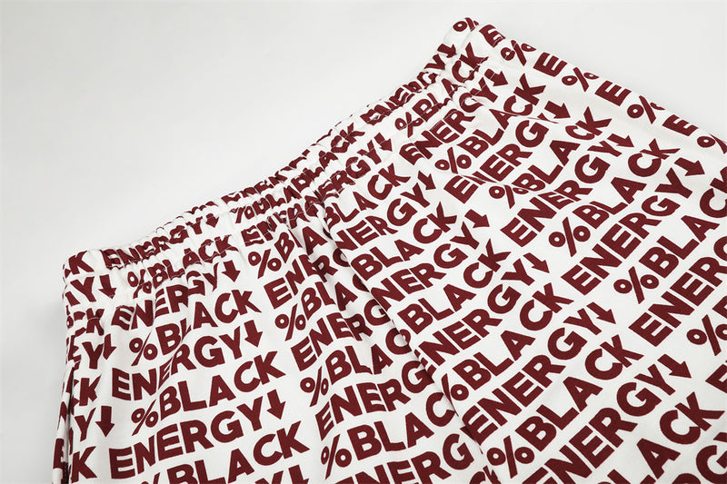 Close-up of folded white fabric with red BLACK ENERGY print
