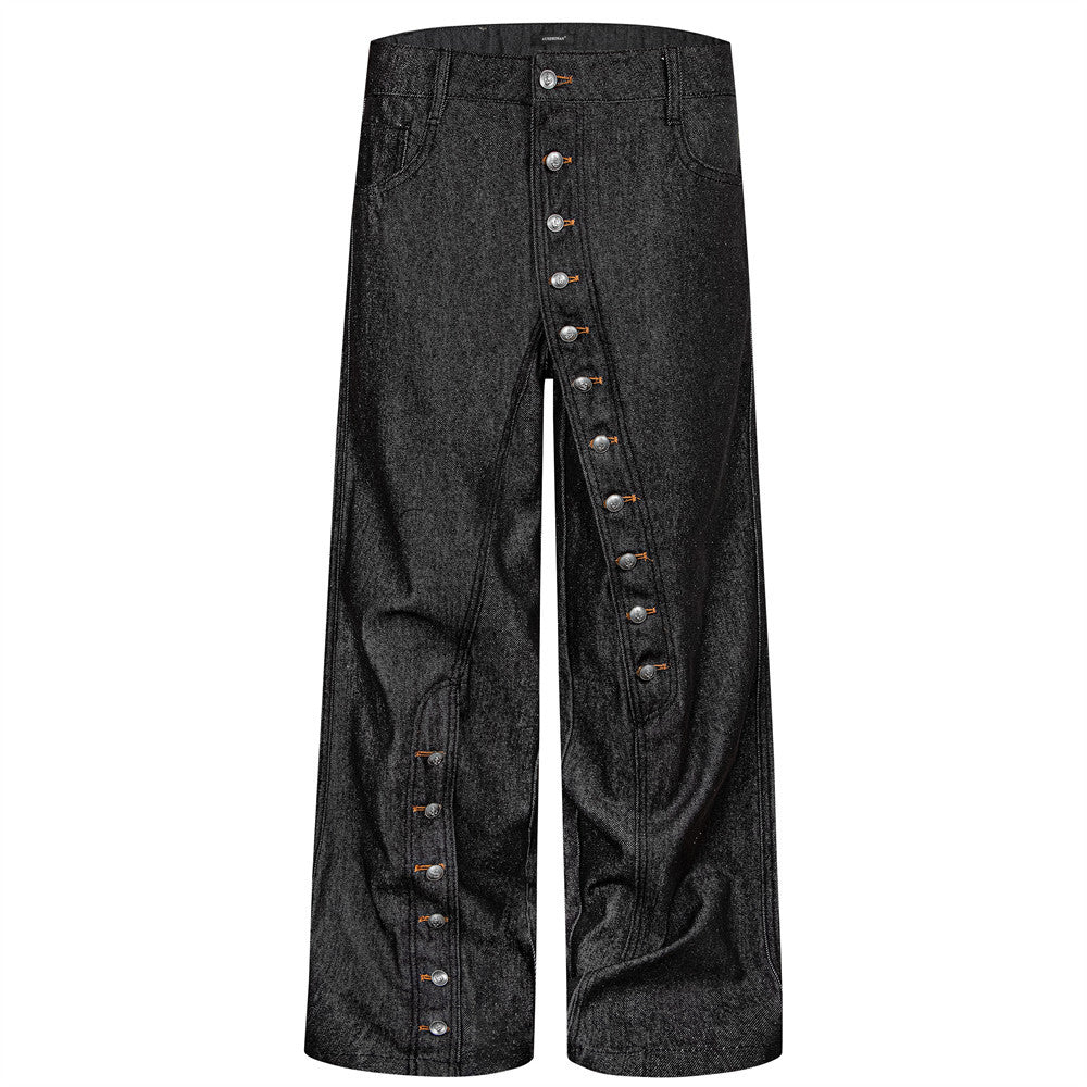 Men's raw black baggy wide-leg jeans with extended diagonal silver button fly, front and back view